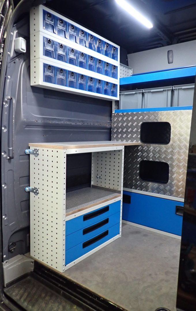 van racking for racing van with bespoke storage for awning