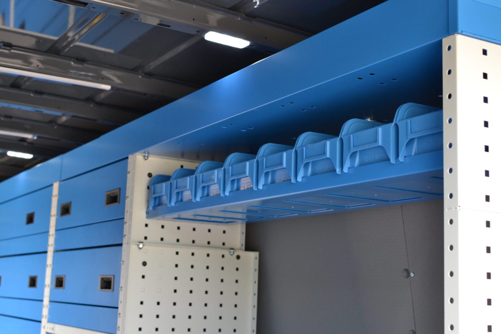 MAN racking system drivers side view shows top tray and storage bins