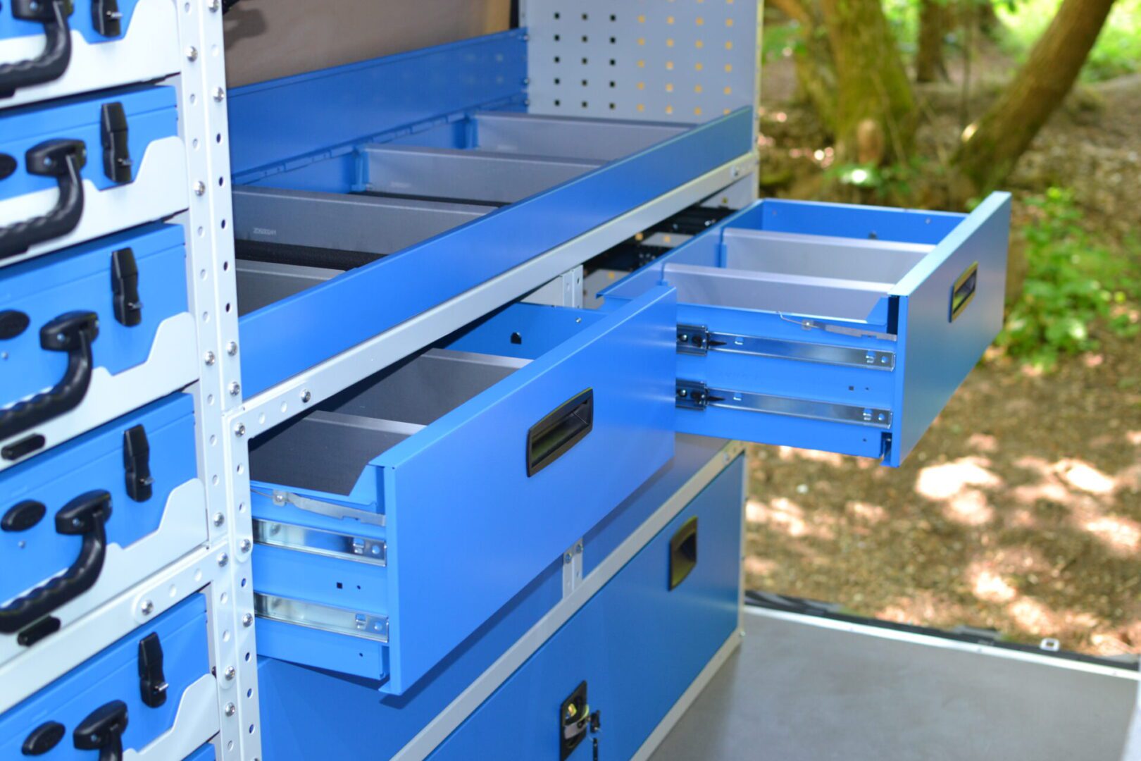 Van racking in a Sprinter drawers and open shelving units