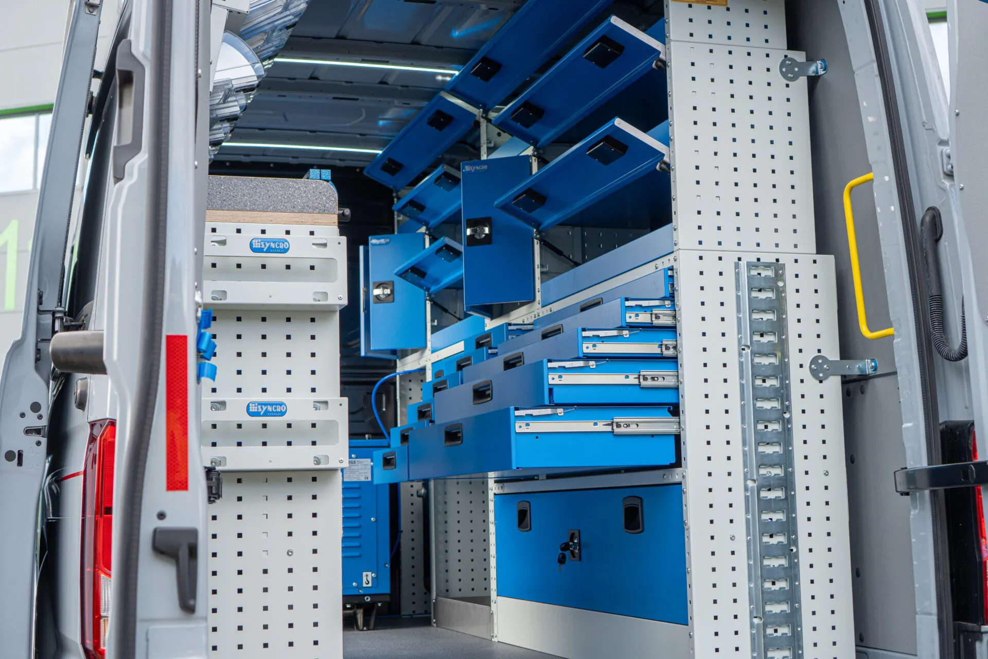 Steel van racking with steel drawers and covered storage areas